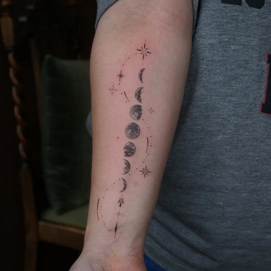 Medium Blackwork Moon Phases Tattoo on Men Arm by @jadejay.ink