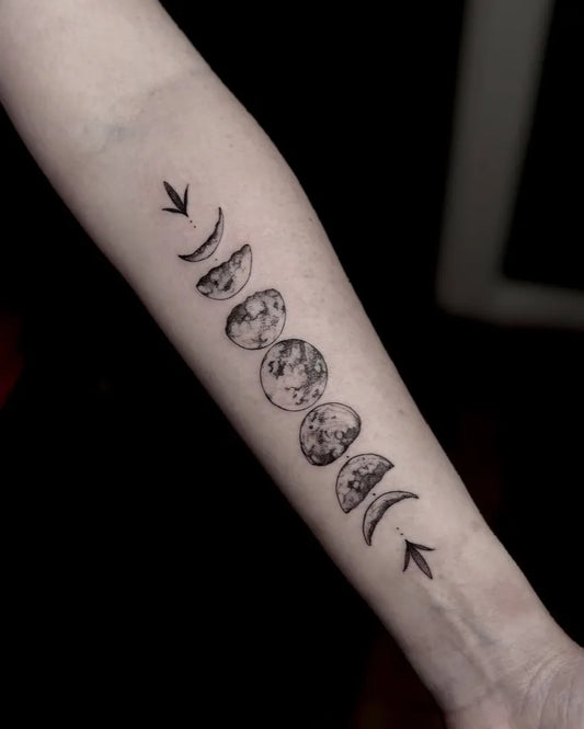Medium Blackwork Moon Phases Tattoo on Women Arm by @iamcharlottelee