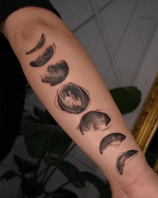 Medium Blackwork Moon Phases Tattoo on Women Arm by @vocozun