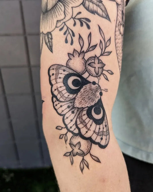 Medium Blackwork Moth and Flowers Tattoo on Women Elbow by @daniturkeysammie