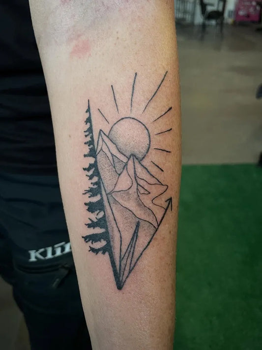 Medium Blackwork Mountain Sun Trees Tattoo on Men Arm by @pure.havic.tattoos