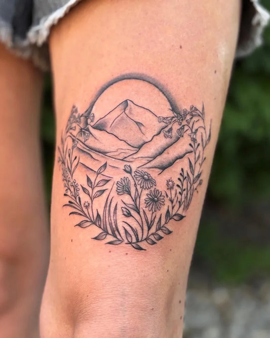 Medium Blackwork Mountain and Flowers Tattoo on Women Thigh by @daniellaturanoart