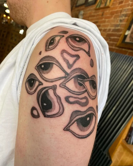 Medium Blackwork Multiple Eyes Tattoo on Men Shoulder by @minatattoos