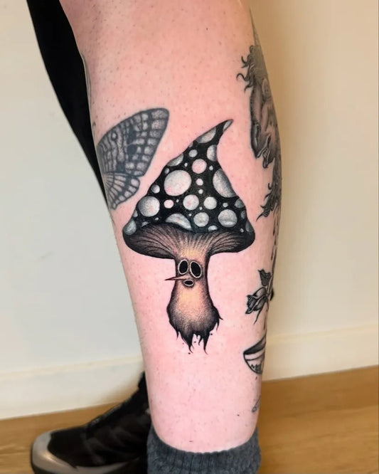 Medium Blackwork Mushroom and Butterfly on Women Leg Tattoo by @tetar_ttt