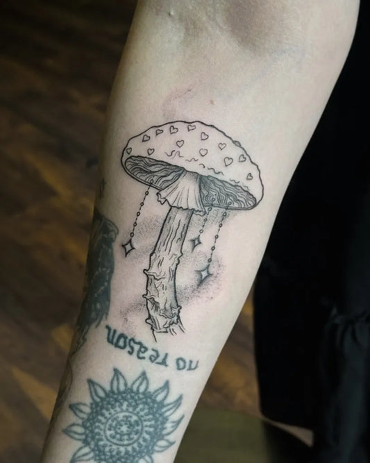 Medium Blackwork Mushroom with Dangling Stars on Women Arm Tattoo by @sakuradoll_ink