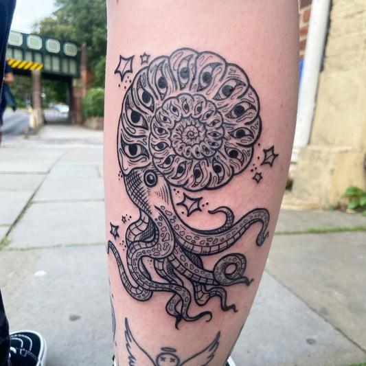Medium Blackwork Nautilus and Octopus Tattoo on Women Calf by @hashbrown_tattoos