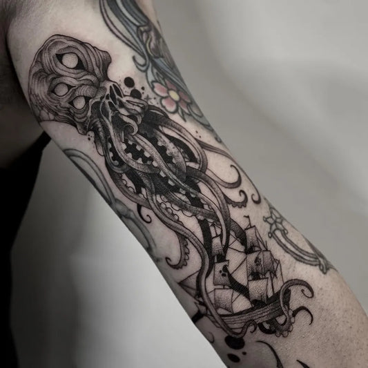 Medium Blackwork Octopus Ship Tattoo on Women Inner Arm by @crvbcore