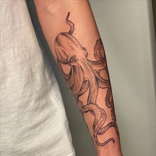 Medium Blackwork Octopus Tattoo on Men Arm by @courtney.tattoos