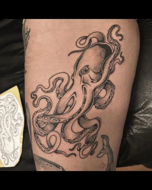 Medium Blackwork Octopus Tattoo on Men Leg by @liv.laeta.tattoo