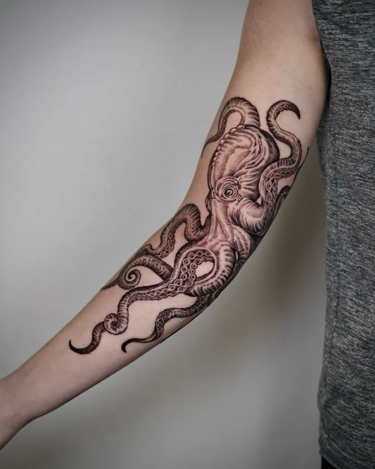 Medium Blackwork Octopus Tattoo on Women Arm by @anjangtattoo