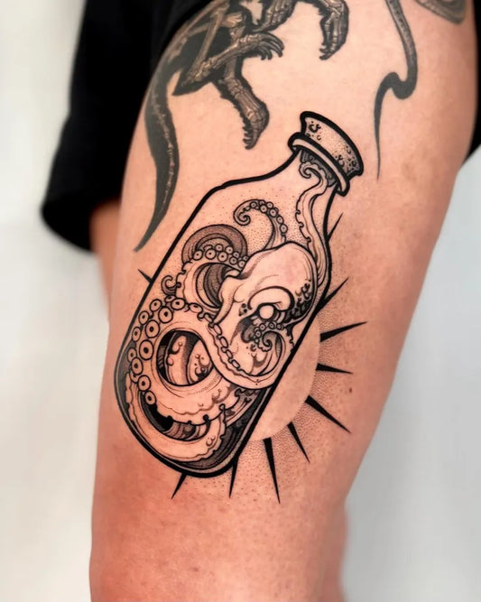 Medium Blackwork Octopus in Bottle Tattoo on Men Thigh by @phiawalla