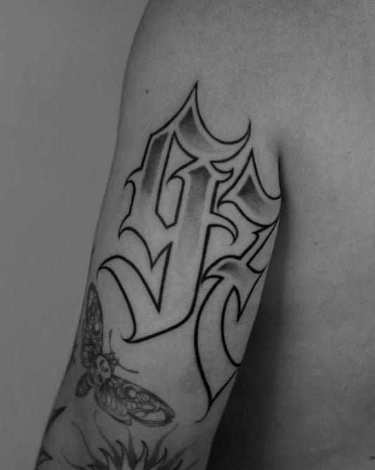 Medium Blackwork Old English Letters 93 Tattoo on Men Upper Arm by @trueblue_tattoo