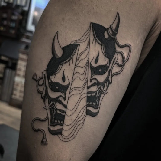 Medium Blackwork Oni Mask Split on Men Arm Tattoo by @katherinejarretattoos