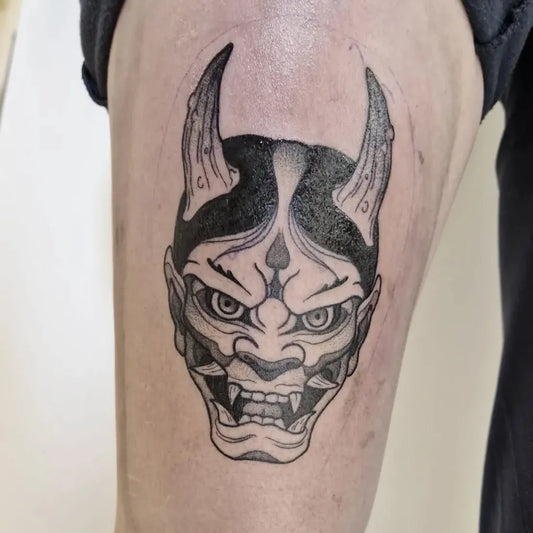Medium Blackwork Oni Mask on Men Thigh Tattoo by @malicious_ink