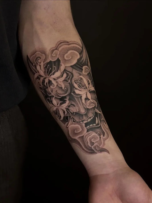 Medium Blackwork Oni Mask with Flowers on Men Arm Tattoo by @emzz.ttt