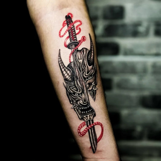 Medium Blackwork Oni Mask with Katana and Red Rope on Men Arm Tattoo by @raveinktattoostudio