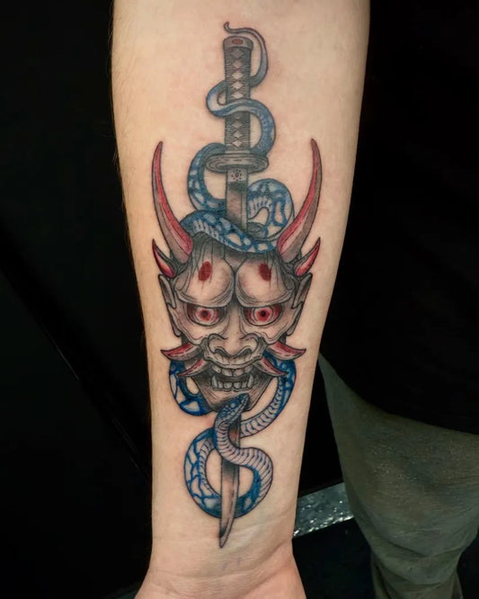 Medium Blackwork Oni Mask with Snake and Sword on Men Arm Tattoo by @bri.tatz