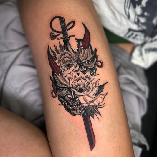 Medium Blackwork Oni Mask with Sword and Roses on Men Thigh Tattoo by @buddhabluetattoo