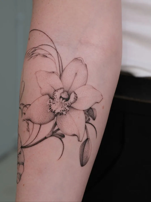 Medium Blackwork Orchid Flower Tattoo on Women Arm by @taniavaiana