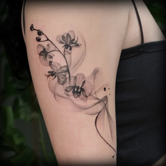 Medium Blackwork Orchid Flowers Tattoo on Women Arm by @cici.geeink.jpg
