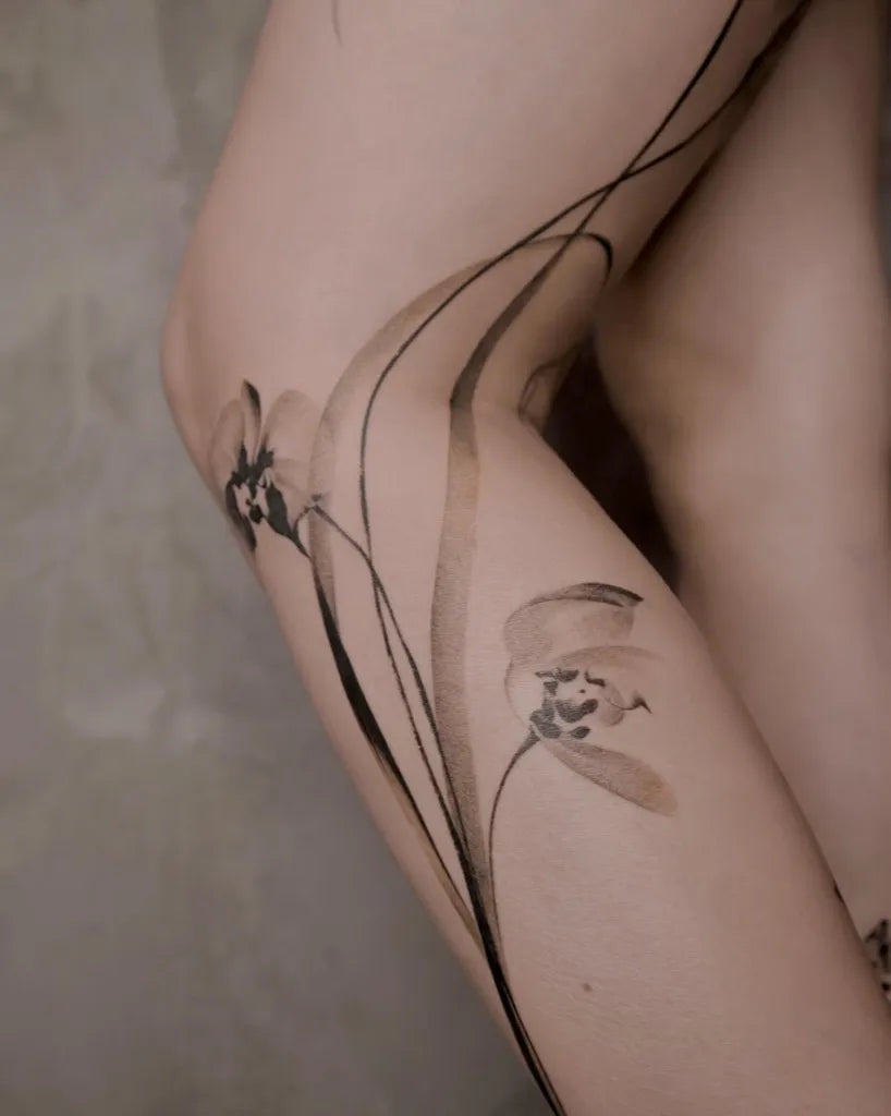 Medium Blackwork Orchid Flowers Tattoo on Women Arm by @rivdttt