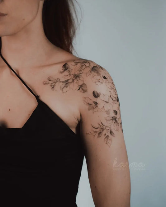 Medium Blackwork Orchid Flowers Tattoo on Women Shoulder by @karolinaszymanska_tattoo