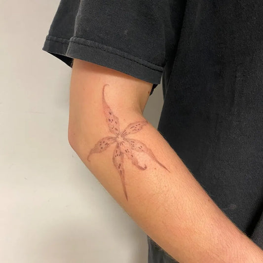 Medium Blackwork Orchid Tattoo on Men Arm by @emmyypoke