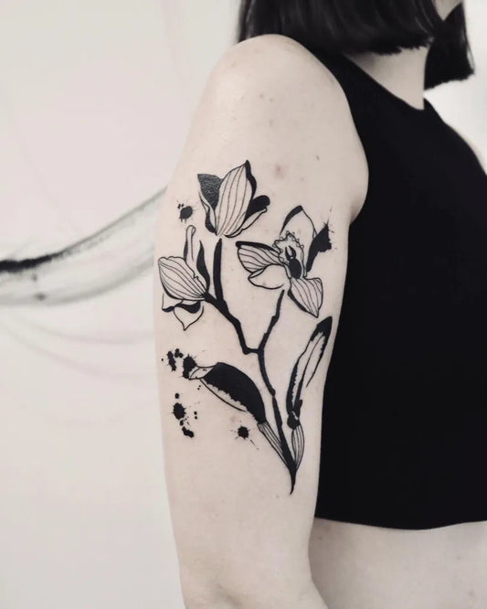 Medium Blackwork Orchid and Leaves Tattoo on Women Upper Arm by @laineycastro_