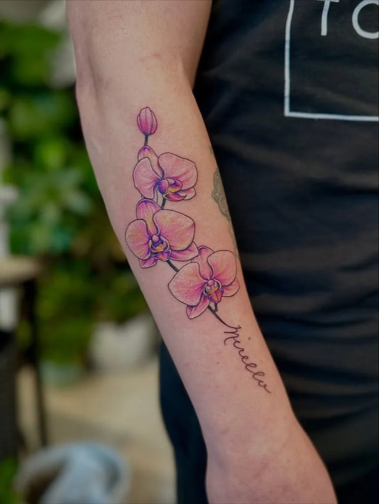 Medium Blackwork Orchid and Script Tattoo on Women Arm by @gwansoontattoos