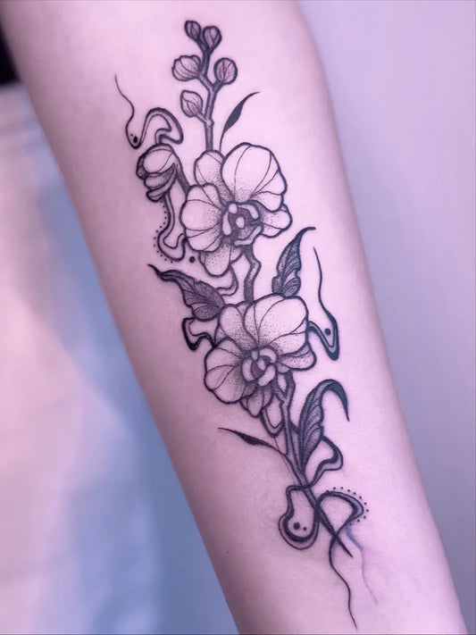 Medium Blackwork Orchid and Snakes Tattoo on Women Arm by @nyath.tattoo