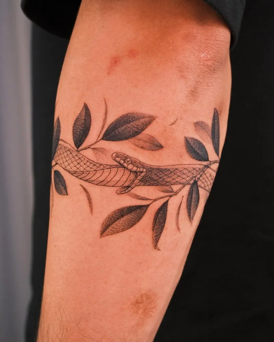 Medium Blackwork Ouroboros Tattoo on Men Arm by @kimbobby_ttt