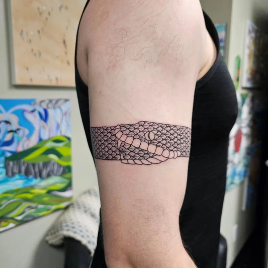 Medium Blackwork Ouroboros Tattoo on Men Arm by @waken_tattoo_studio