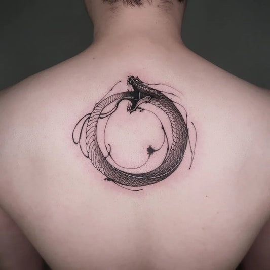 Medium Blackwork Ouroboros Tattoo on Men Back by @__1.0__