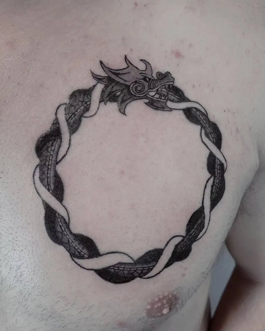 Medium Blackwork Ouroboros Tattoo on Men Chest by @hime.ink