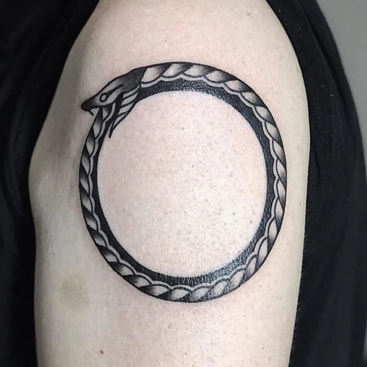 Medium Blackwork Ouroboros Tattoo on Men Upper Arm by @805ink