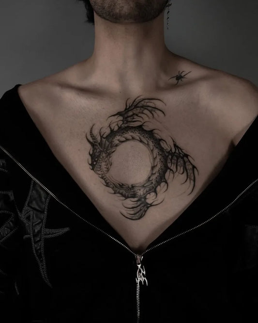 Medium Blackwork Ouroboros Tattoo on Women Chest by @mistermonster_