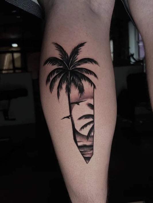 Medium Blackwork Palm Tree Sunset Tattoo on Men Leg by @stoke.23