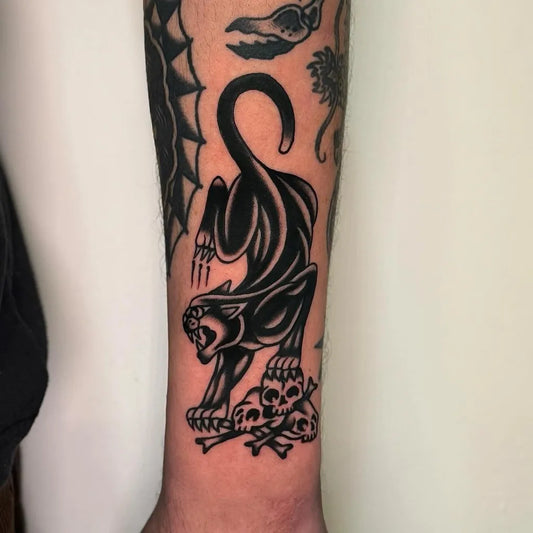 Medium Blackwork Panther Skulls Tattoo on Men Arm by @tonykingtattoo