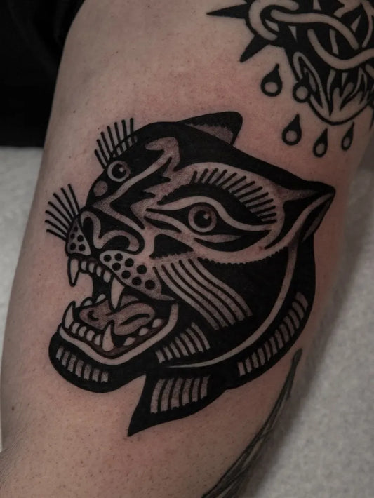 Medium Blackwork Panther Tattoo on Men Arm by @yuri.tattoos