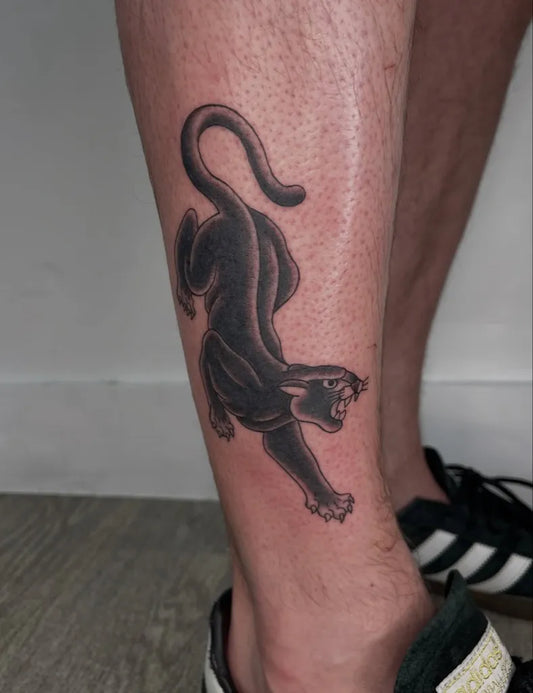 Medium Blackwork Panther Tattoo on Men Leg by @nannon.anon