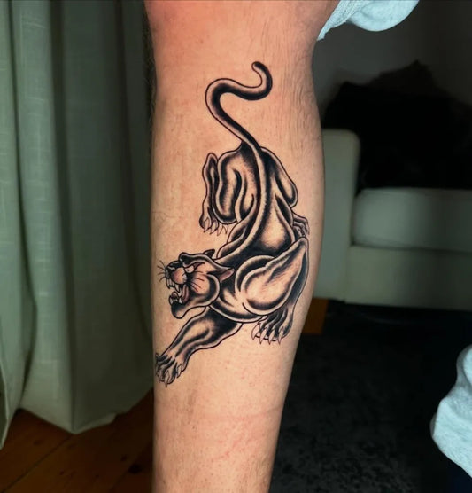Medium Blackwork Panther Tattoo on Men Leg by @nix.tatt
