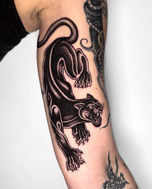 Medium Blackwork Panther Tattoo on Women Arm by @jae_tatt