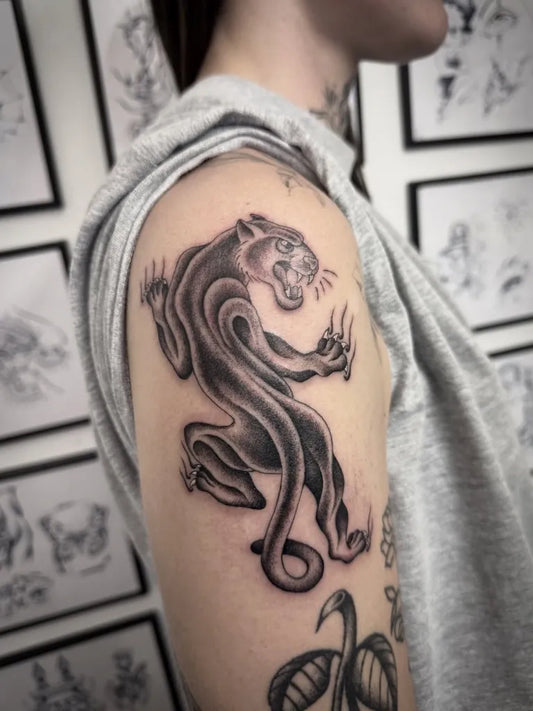 Medium Blackwork Panther Tattoo on Women Shoulder by @sonnyrohantattoo