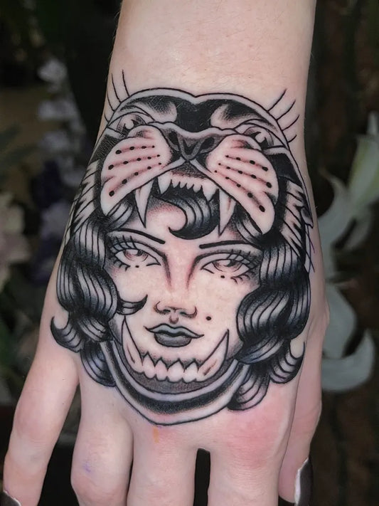 Medium Blackwork Panther Woman Tattoo on Hand by @joshcoburntattoo