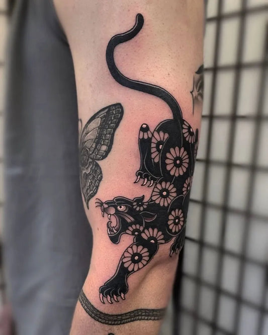 Medium Blackwork Panther and Butterfly Tattoo on Men Arm by @jakeheerytattoo