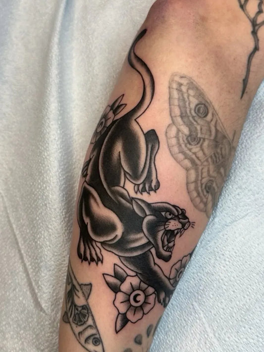 Medium Blackwork Panther and Moth Tattoo on Men Arm by @annahasseltine
