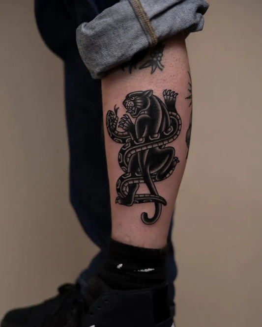 Medium Blackwork Panther and Snake Tattoo on Men Leg by @tommytraditional
