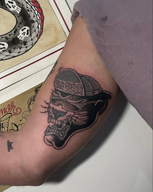 Medium Blackwork Panther in Cap Tattoo on Men Arm by @gipsy_tatt