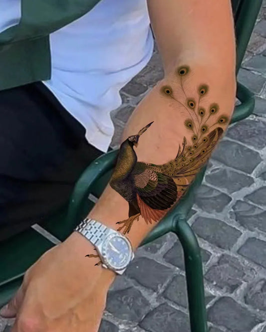 Medium Blackwork Peacock Tattoo on Men Arm by @onsil.ink