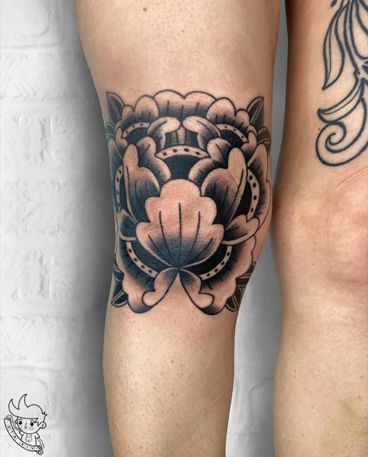 Medium Blackwork Peony Tattoo on Women Knee by @dta.tattoo